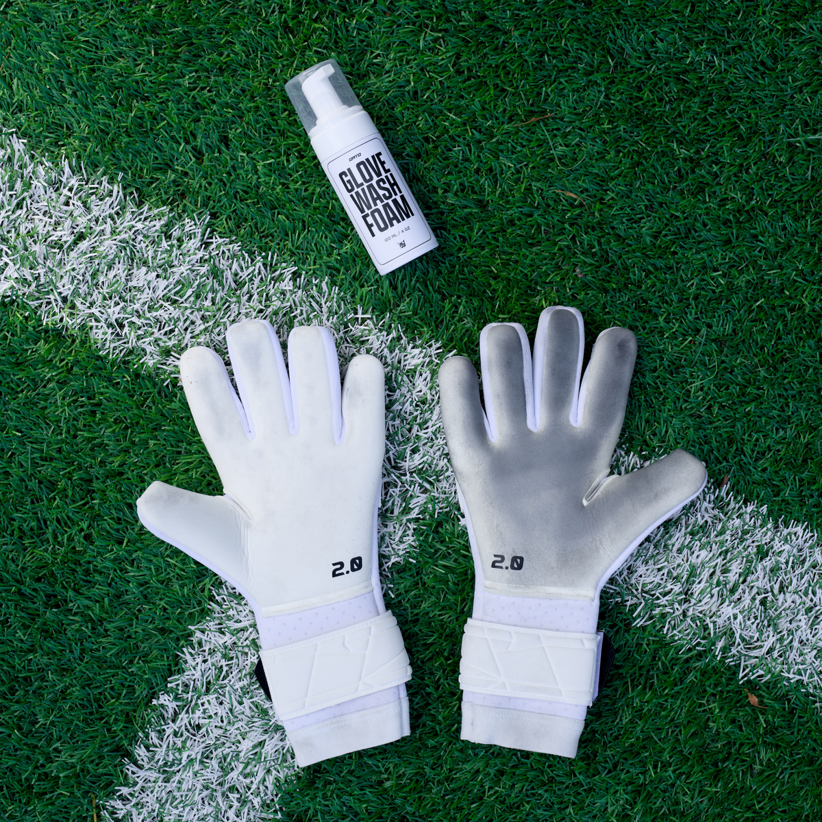 A clean and a used GATO glove next to GATO Glove Wash Foam